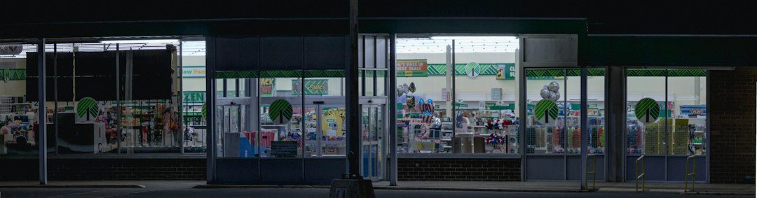 a store front at night with the lights on