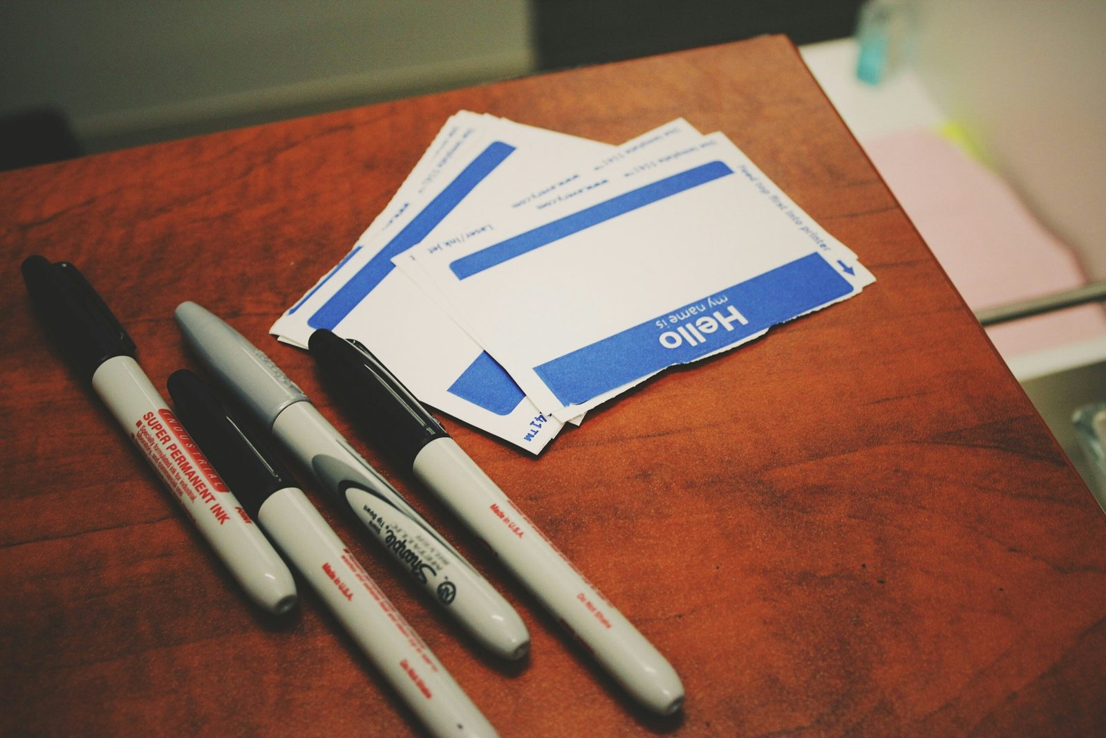 four markers on table