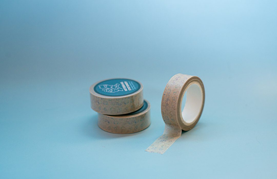 A couple of rolls of tape sitting next to each other